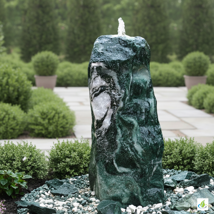 Lappland Green quartzite fountain set with a green stone surface in a garden